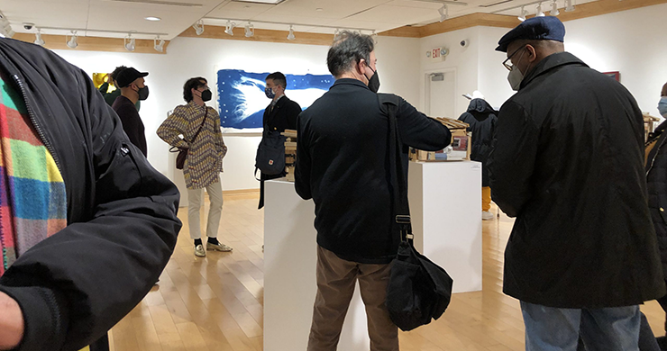 First Thursdays at Riverfront Art Gallery image showing several guests enjoying the exhibit