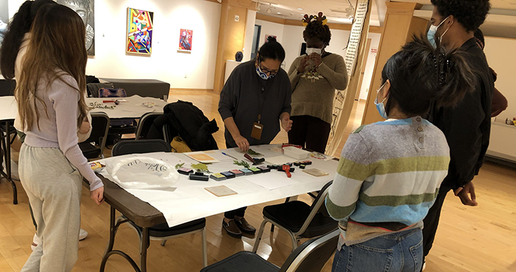 Teen Art Workshop at Riverfront Art Gallery showing multiple teens participating in a craft