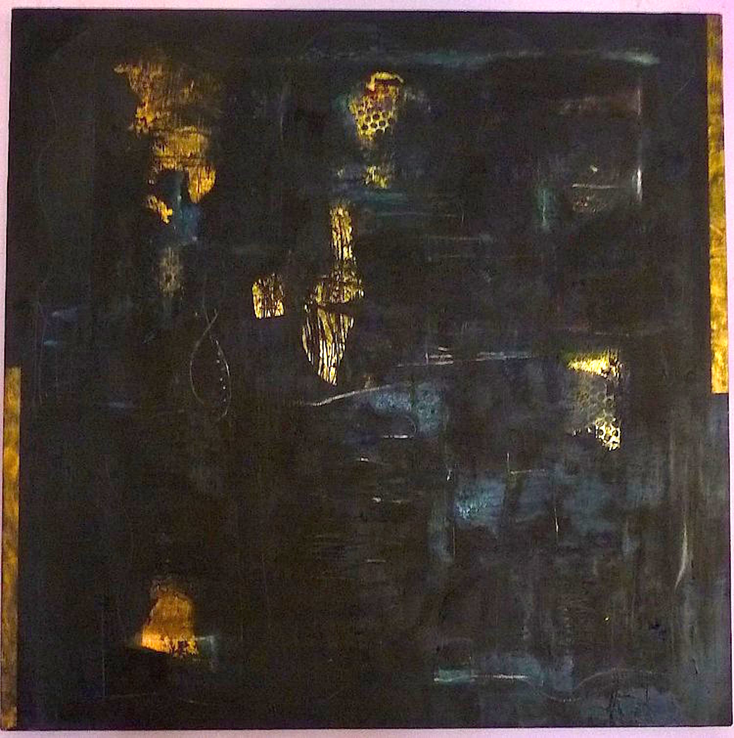 Dark painting with flecks of gold shining through the holes in the black.