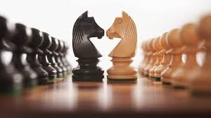 knights face to face on a chess board