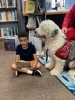 Image of child reading to Cooper