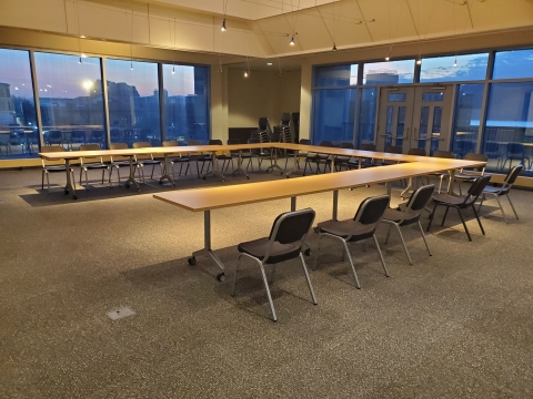 Photo of Yonkers room with tables and chairs setup in horseshoe pattern