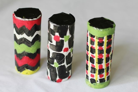 DIY toilet paper roll maracas painted with various designs