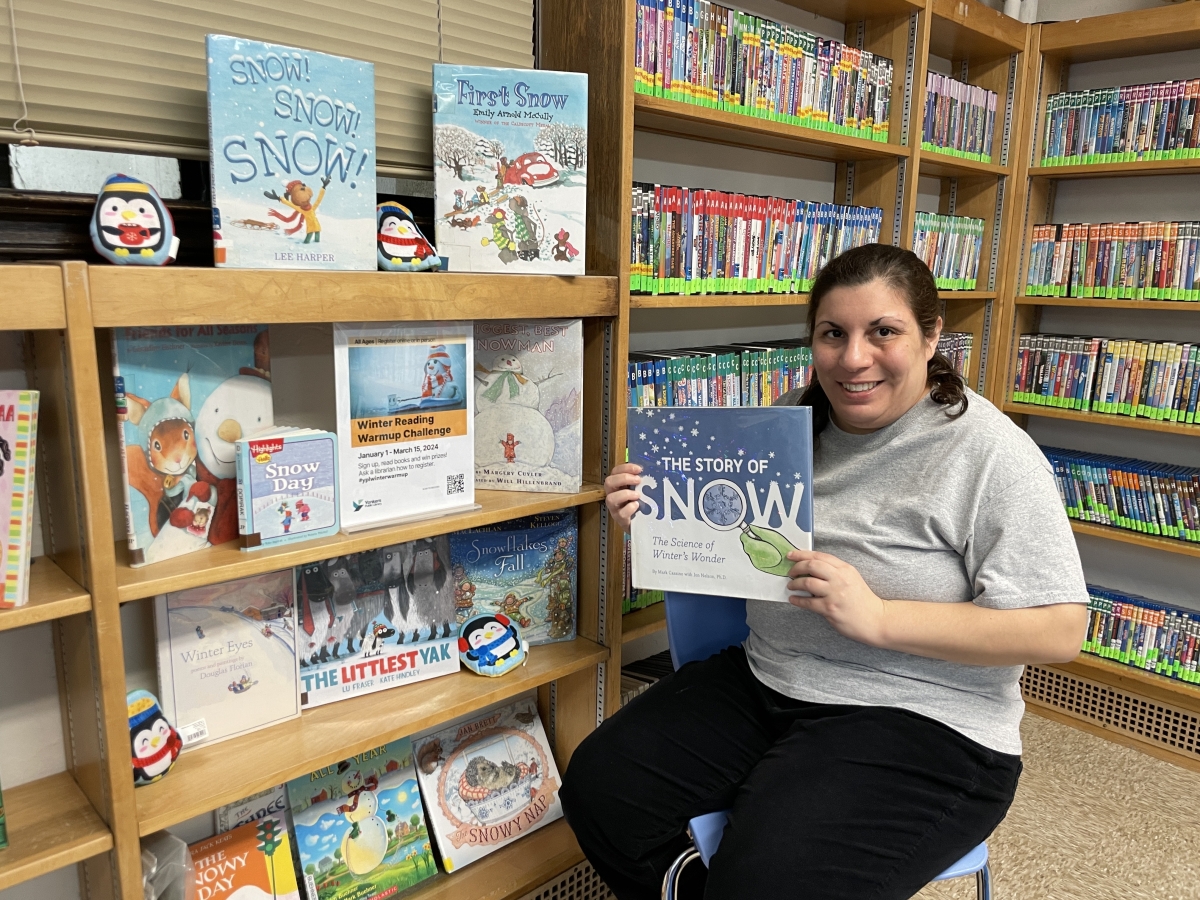 Image of Liz Caruso with Story Craft books