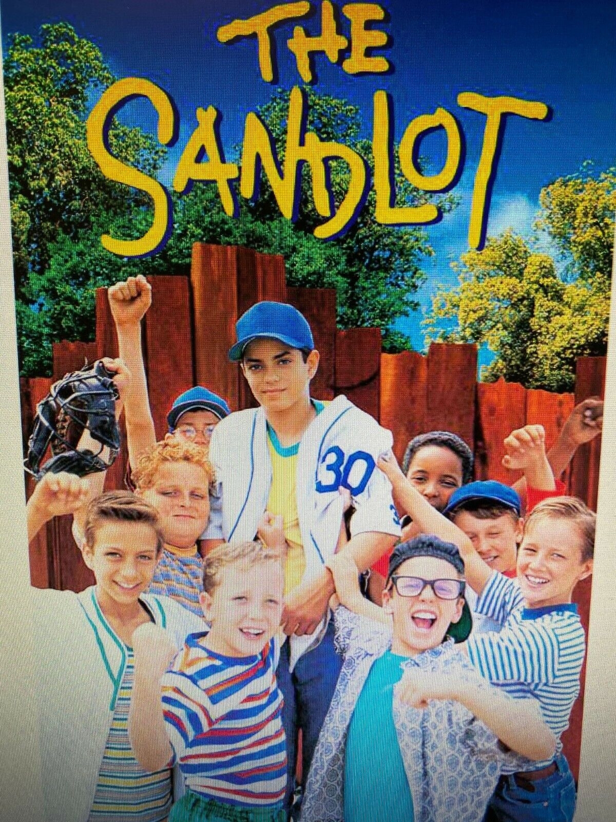 the sandlot in bold type above group of boy baseball players