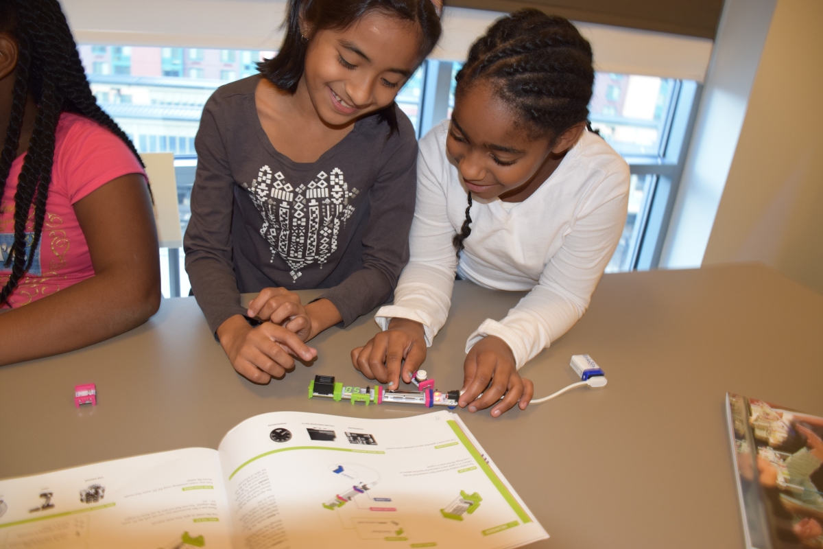 2 girls working on a circuit