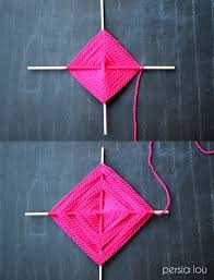 sample of God's eye craft using pink yarn