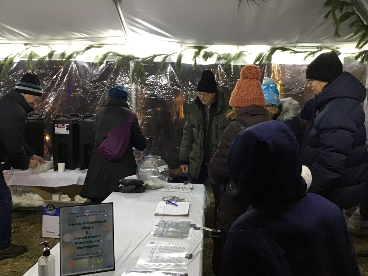 photo of Friends of Crestwood Library serving hot chocolate at Untermyer Garden Conservancy